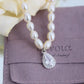 white pearl necklace with fake diamond pendant that look real