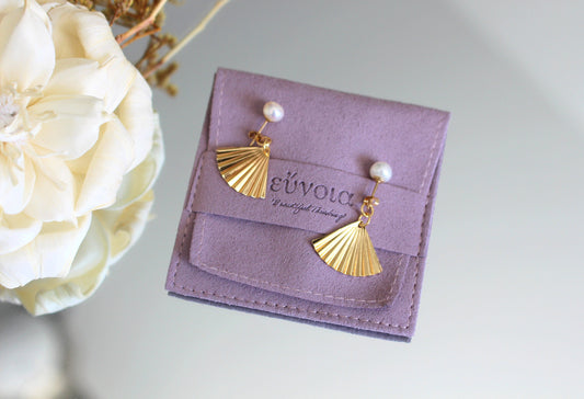 gold and pearl statement earrings