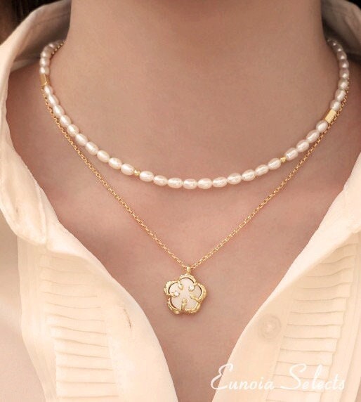 Elegant pearl chain and shell pendant necklace