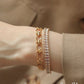 chunky gem jewels tennis bracelet for women on a model's wrist
