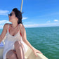Model wearing Zoe Oversize hoops on a boat