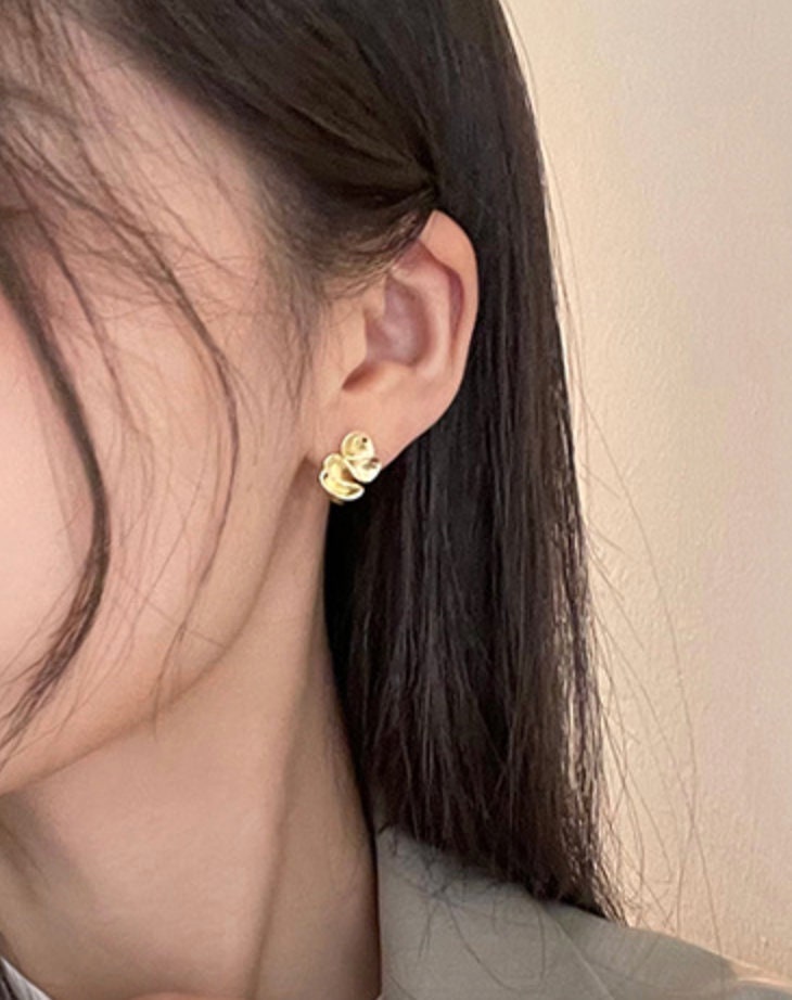 model demonstrating minimalist gold earrings for women