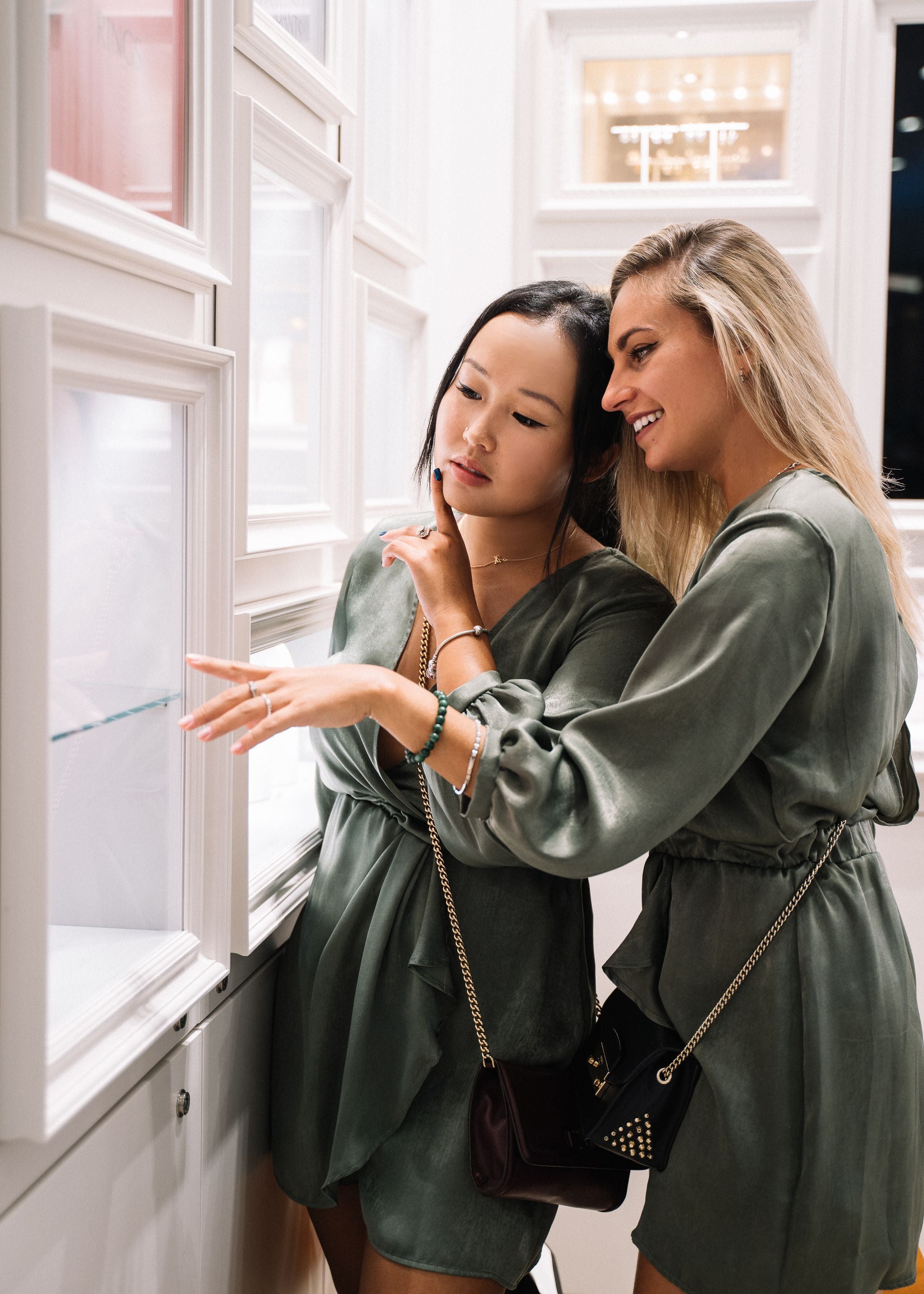 Two friends shopping for jewelry together